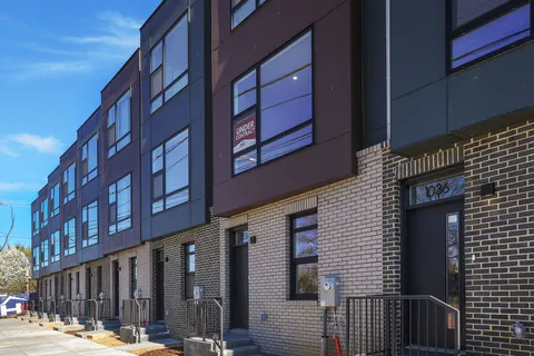 a view of a building on a street
