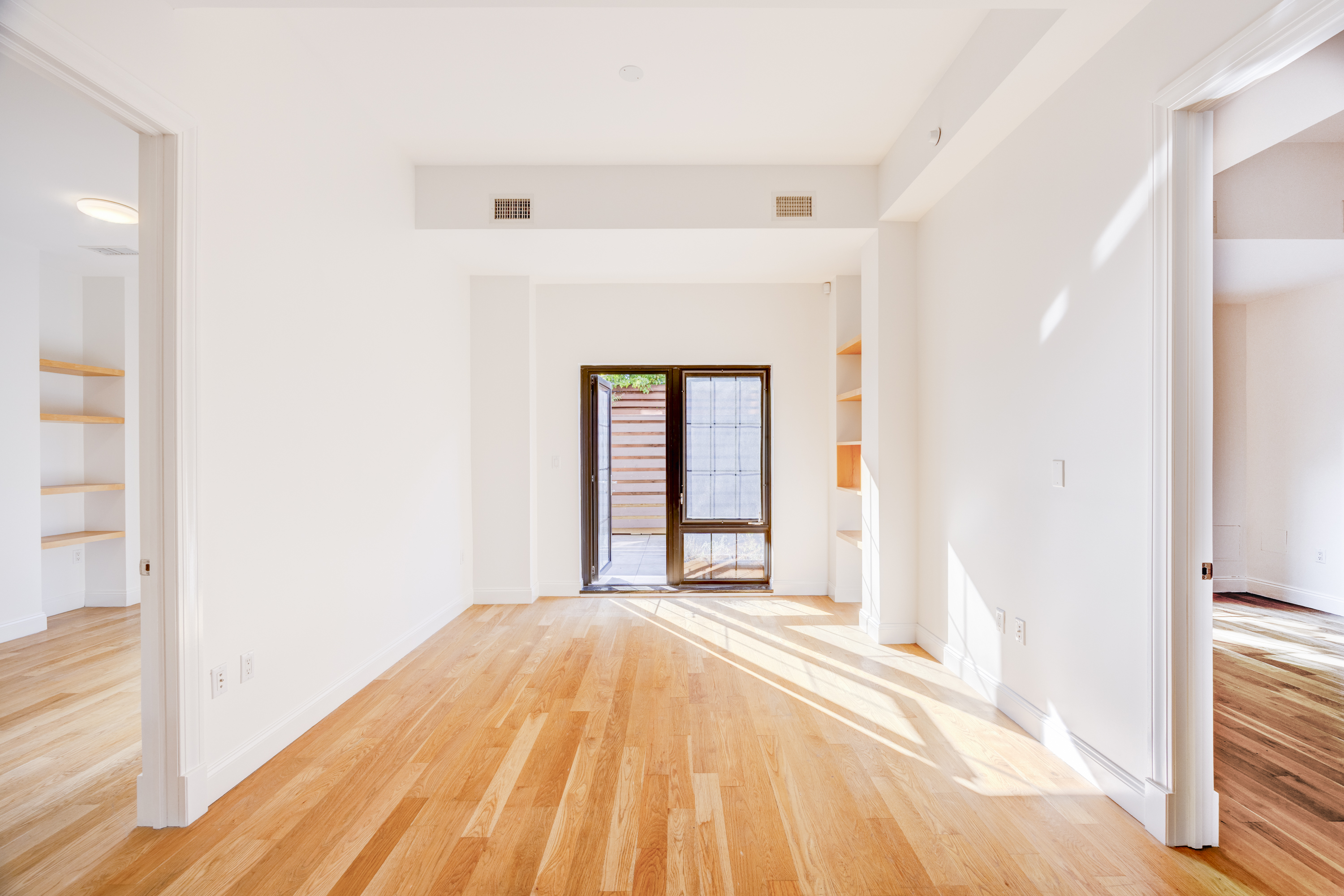 42 Maspeth Avenue, Unit 1D Brooklyn, NY 11211 - Photo 10 of 28 a bedroom with a bed and a window