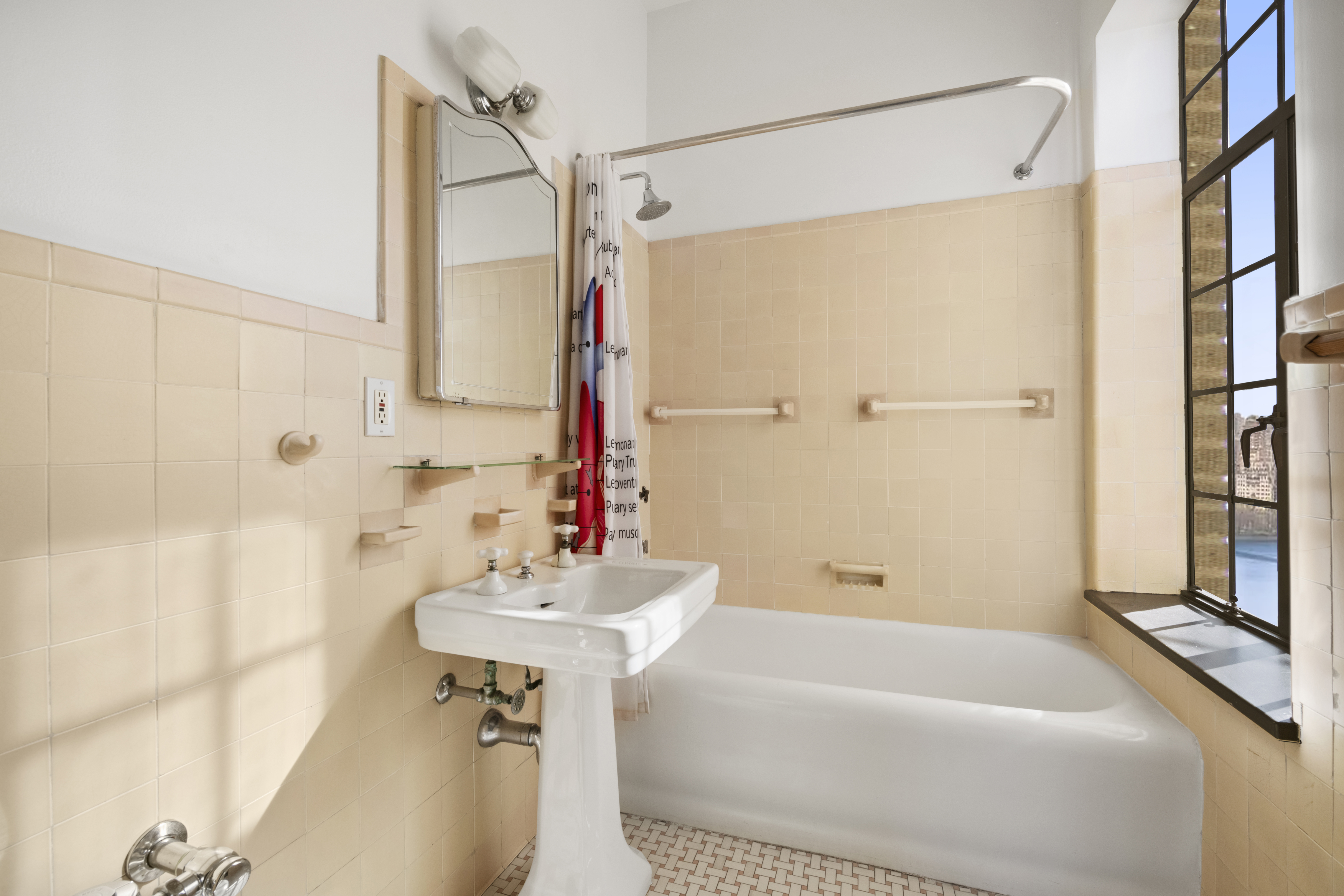 300 Central Park West, Unit 21G Manhattan, NY 10024 - Photo 16 of 21 a bathroom with a sink and a bathtub