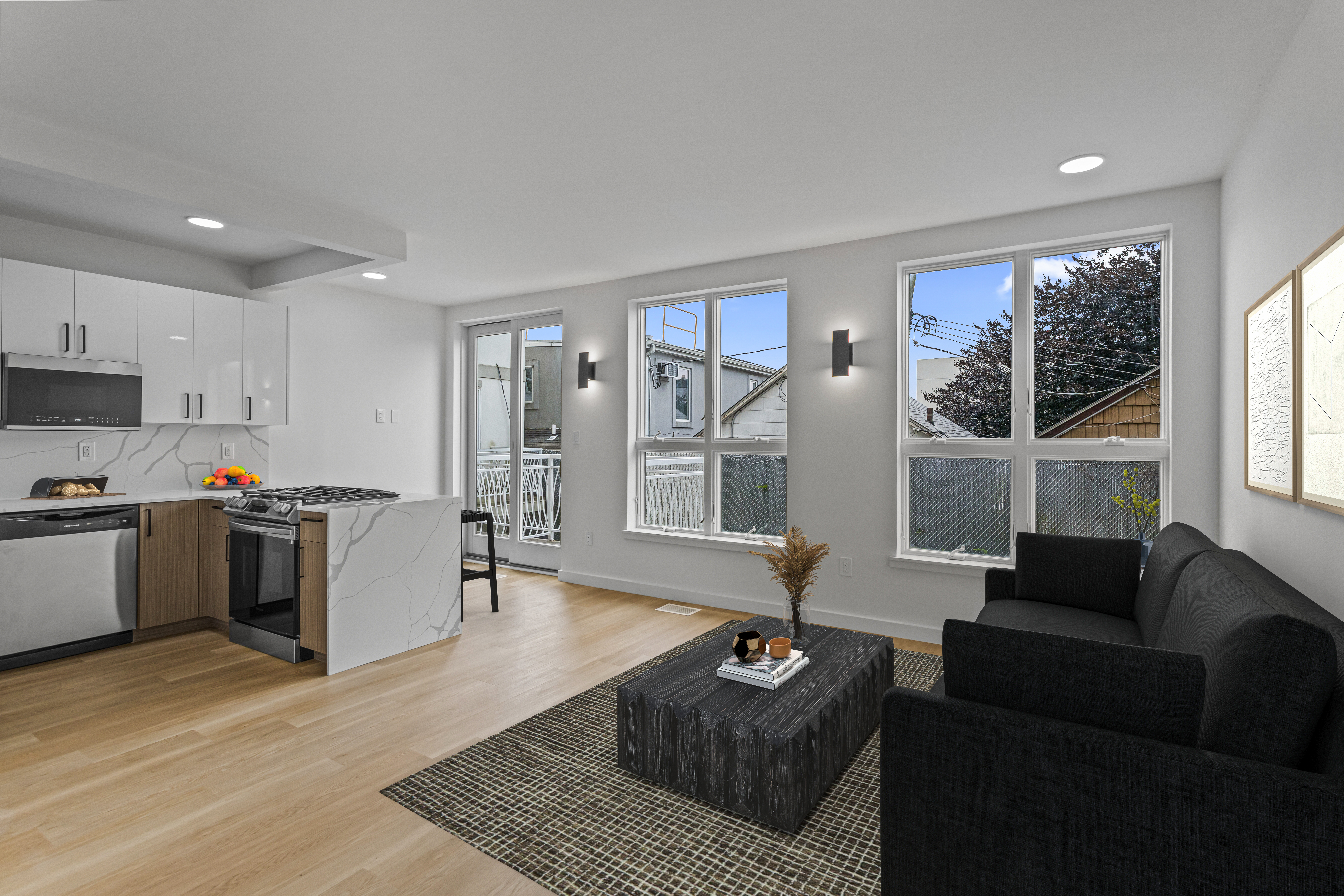 3112 Emmons Avenue, Unit 3120A-2 Brooklyn, NY 11235 - Photo 2 of 14 a living room with furniture and a couch