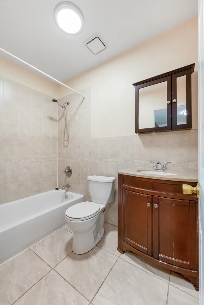 a bathroom with a toilet a sink and bathtub