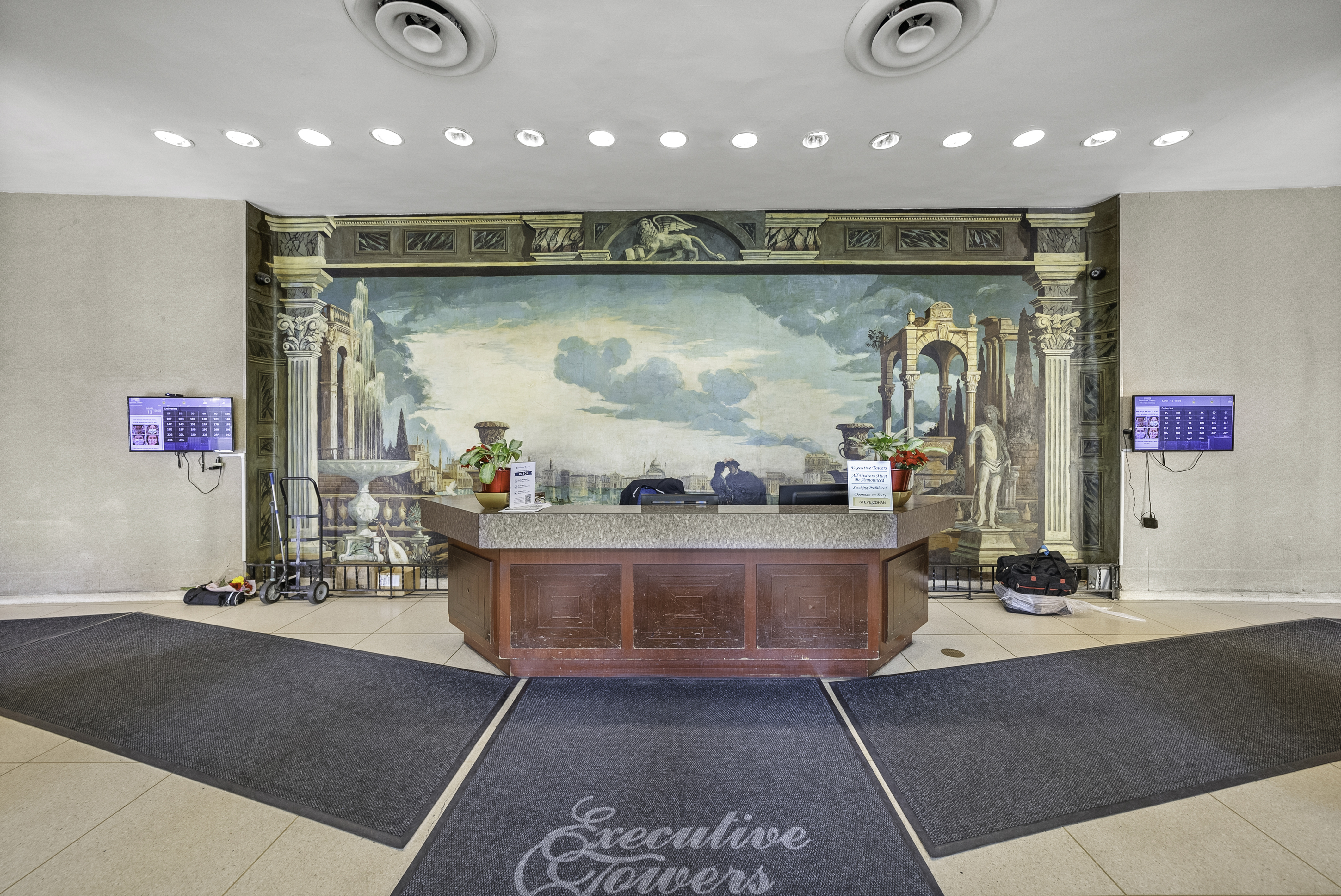 1020 Grand Concourse, Unit 5G Bronx, NY 10451 - Photo 10 of 11 a living room with stainless steel appliances kitchen island furniture a rug and a kitchen view
