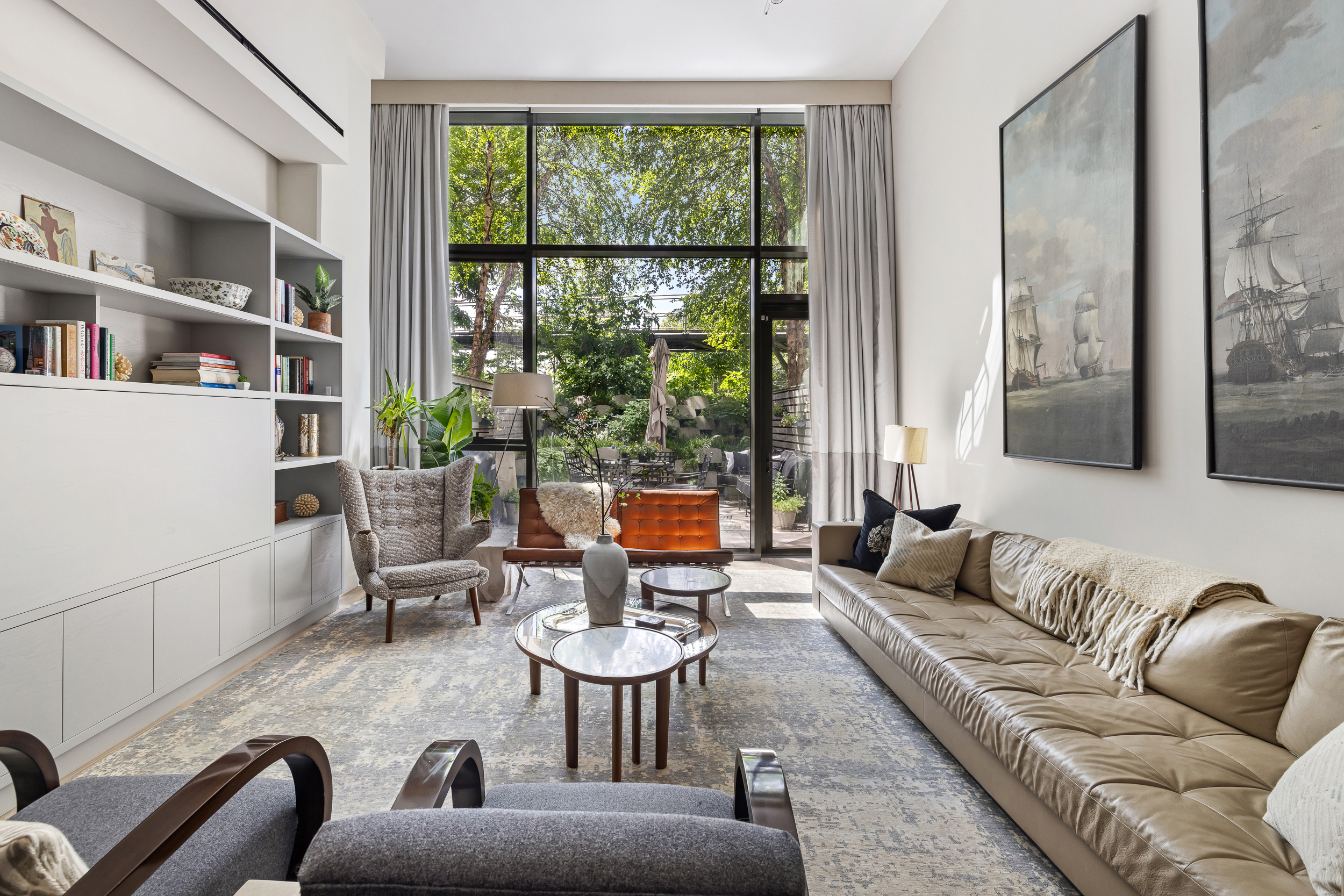 90 Furman Street, Unit N107 Brooklyn, NY 11201 - Photo 5 of 30 a living room with furniture and a floor to ceiling window