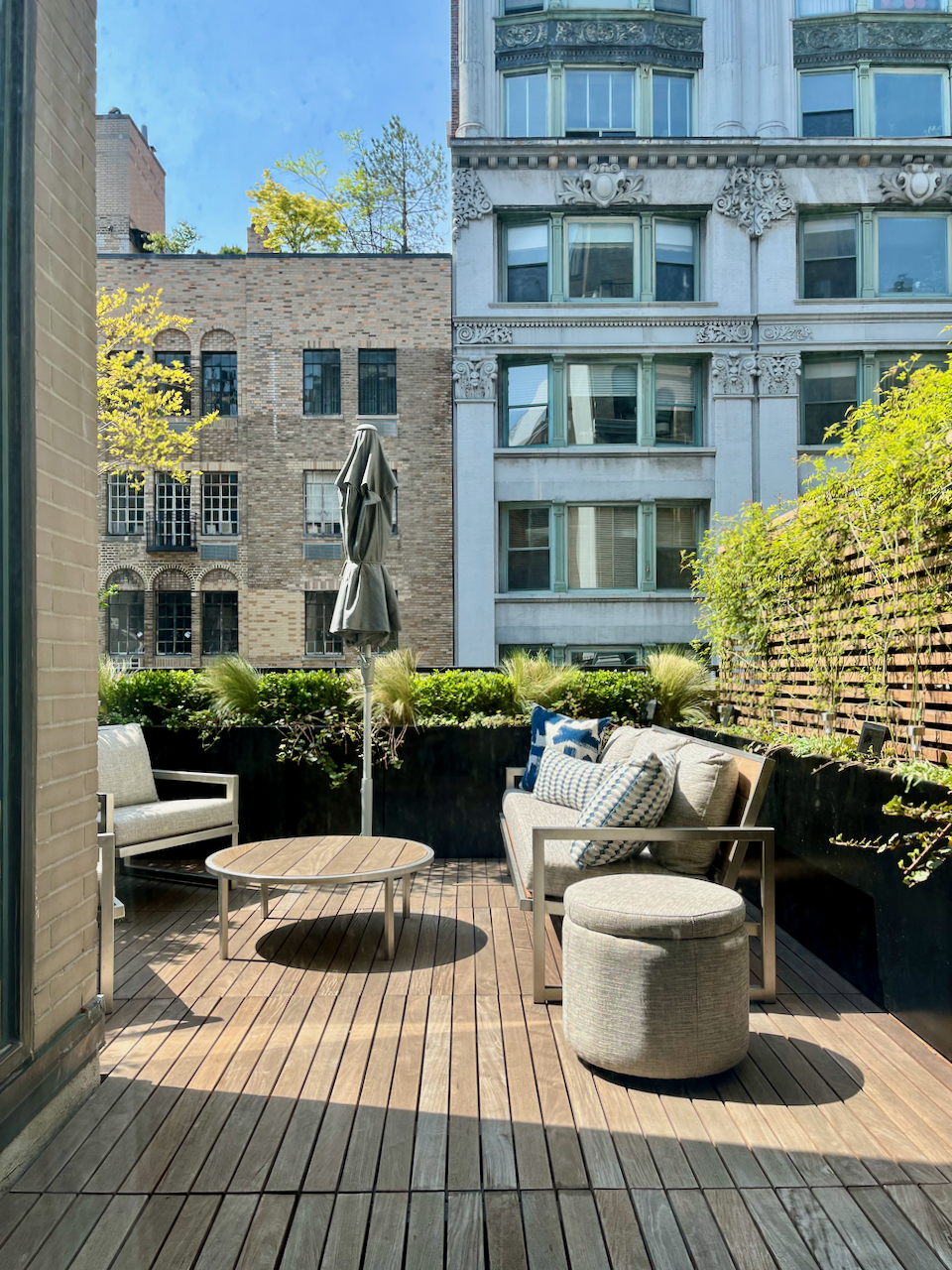 35 East 10th Street, Unit 4J Manhattan, NY 10003 - Photo 18 of 19 a view of a patio with couches chairs and potted plants
