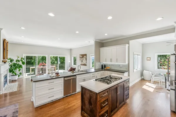 a kitchen with a stove a sink and a refrigerator