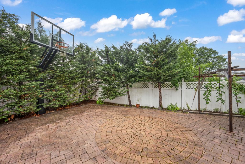 79 Sparkill Avenue Staten Island, NY 10304 - Photo 28 of 32 a view of a yard with potted plants and large trees