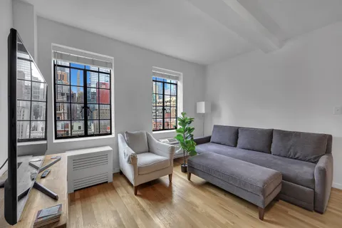 a living room with furniture and a window