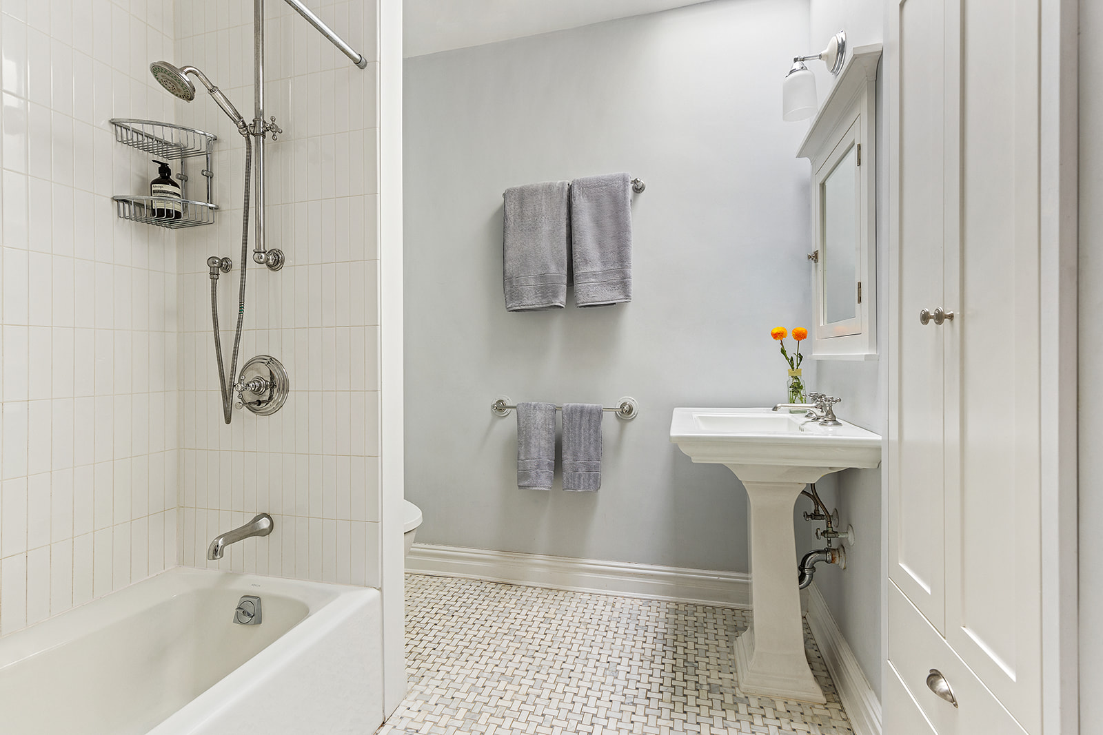 146 Berkeley Place Brooklyn, NY 11217 - Photo 10 of 21 a bathroom with a sink a mirror and a bathtub