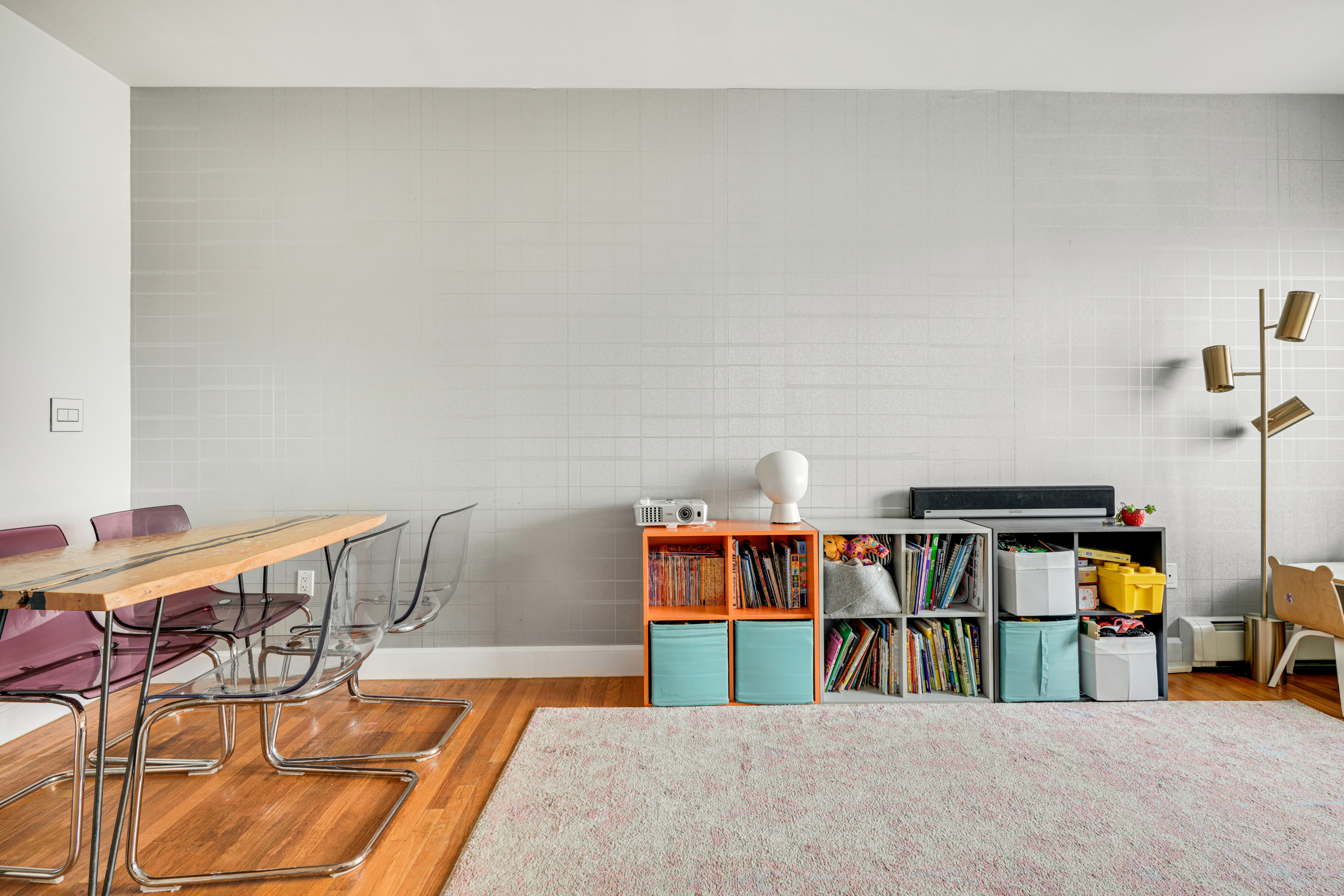 1820 Madison Avenue, Unit 7C Manhattan, NY 10035 - Photo 7 of 17 a bedroom with furniture and a book shelf
