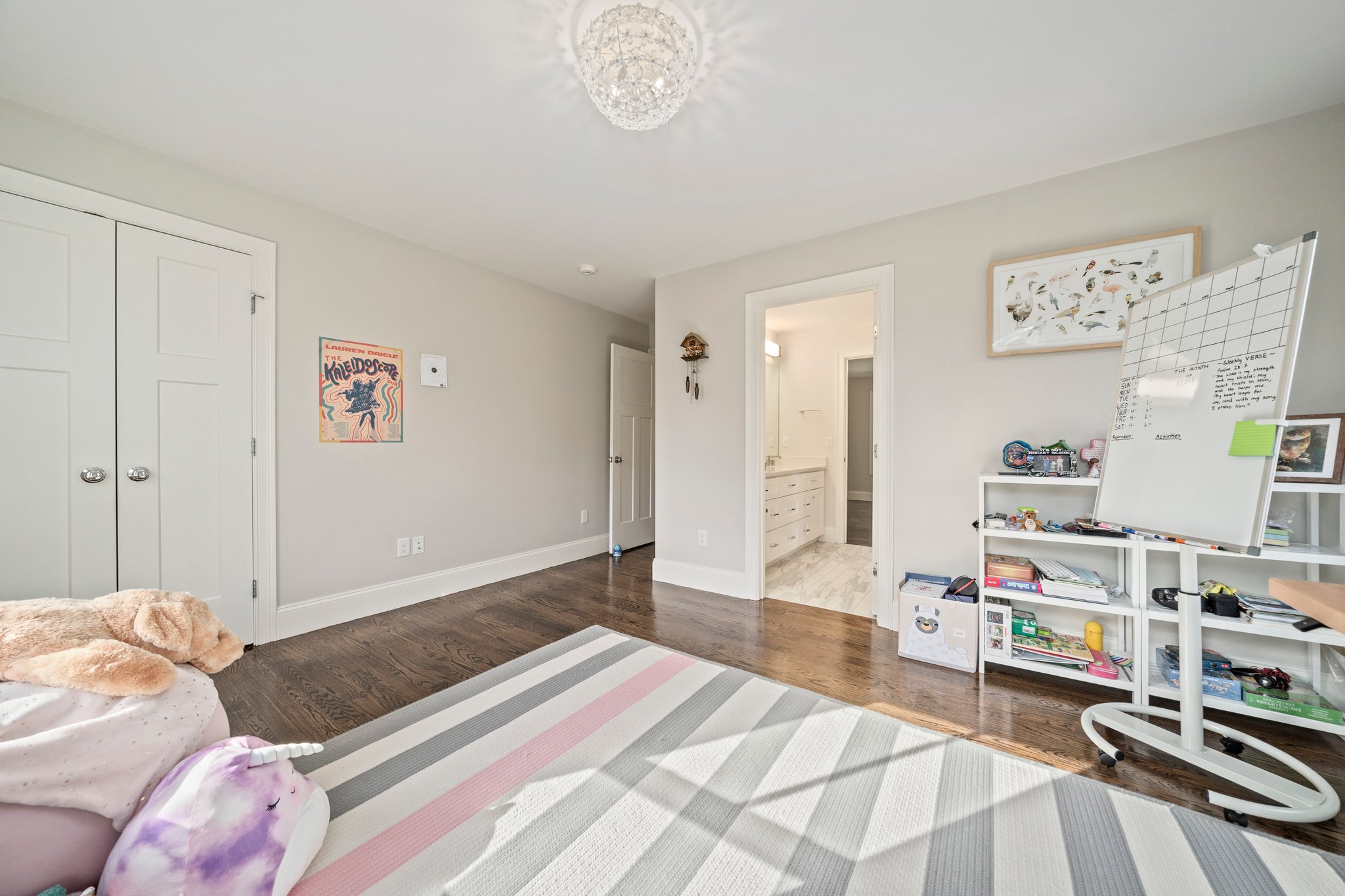 241 Lowell Road Wellesley, MA 02481 - Photo 24 of 85 a bedroom with furniture and a chandelier