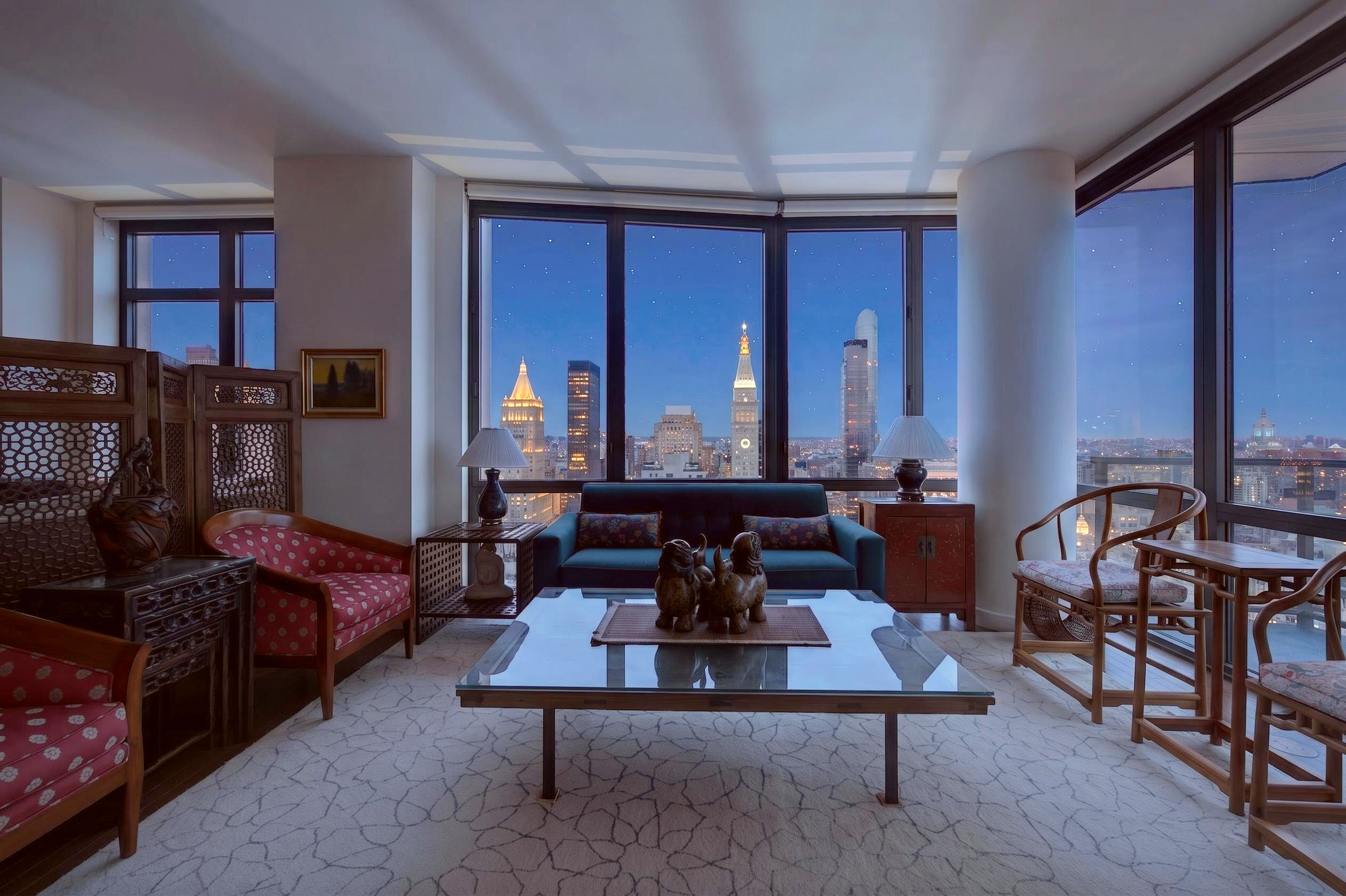 101 West 24th Street, Unit 36C Manhattan, NY 10011 - Photo 2 of 27 a living room with furniture a rug and a window