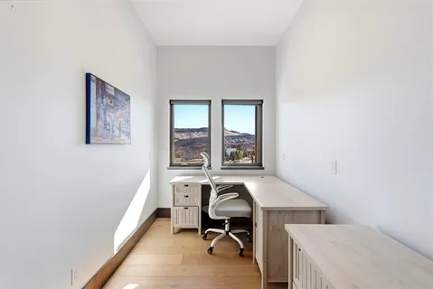 a view of a room with a large window