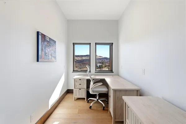 a view of a room with a large window