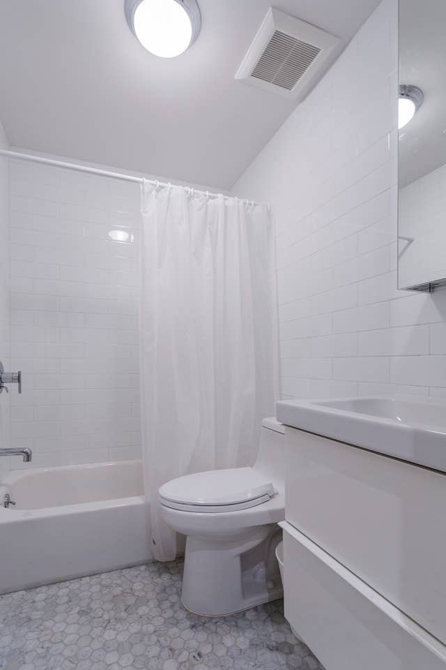 13 West 127th Street, Unit 1 Manhattan, NY 10027 - Photo 8 of 8 a bathroom with a toilet and a bathtub