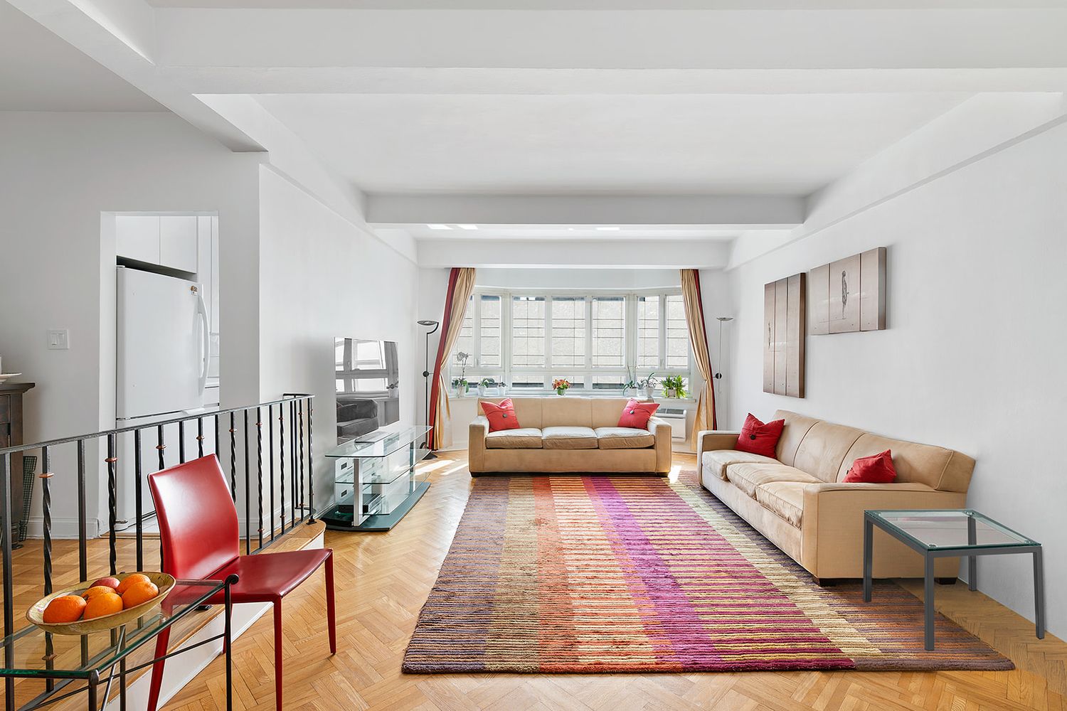 a living room with furniture and a rug