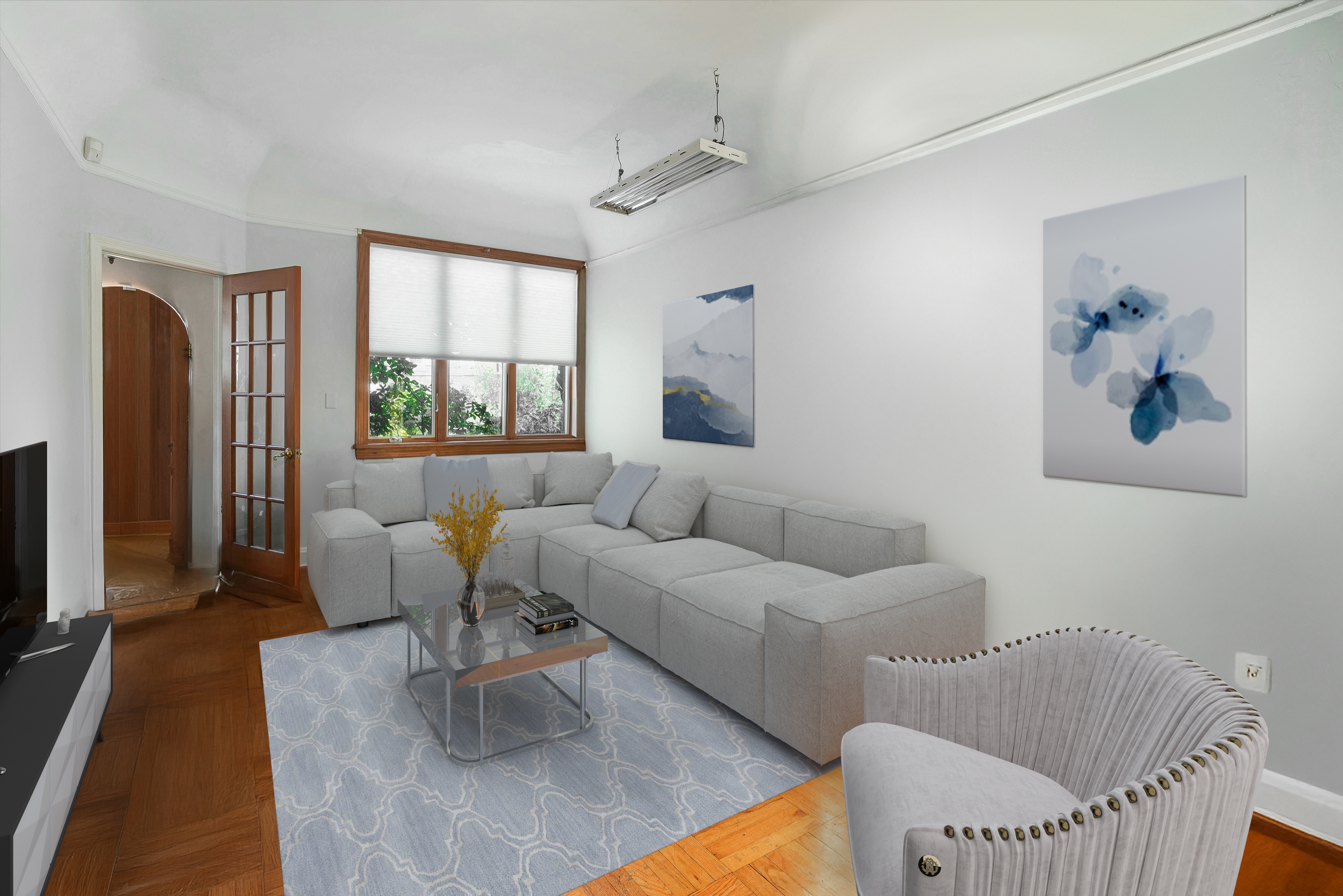 233 Battery Avenue Brooklyn, NY 11209 - Photo 3 of 26 a living room with furniture and a flat screen tv