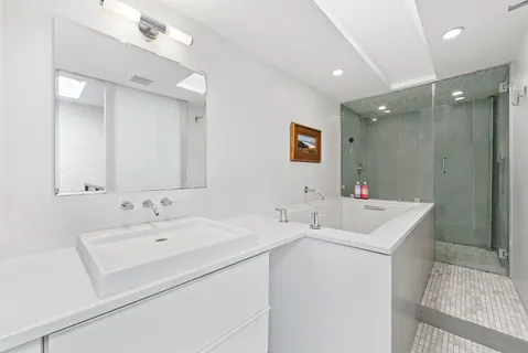 a dining hall with stainless steel appliances a dining table and chairs with wooden floor