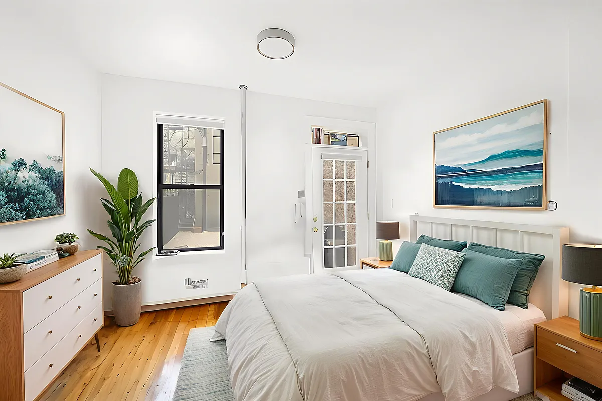 53 3rd Street, Unit 1R Brooklyn, NY 11231 - Photo 5 of 6 a bedroom with a bed and a large window