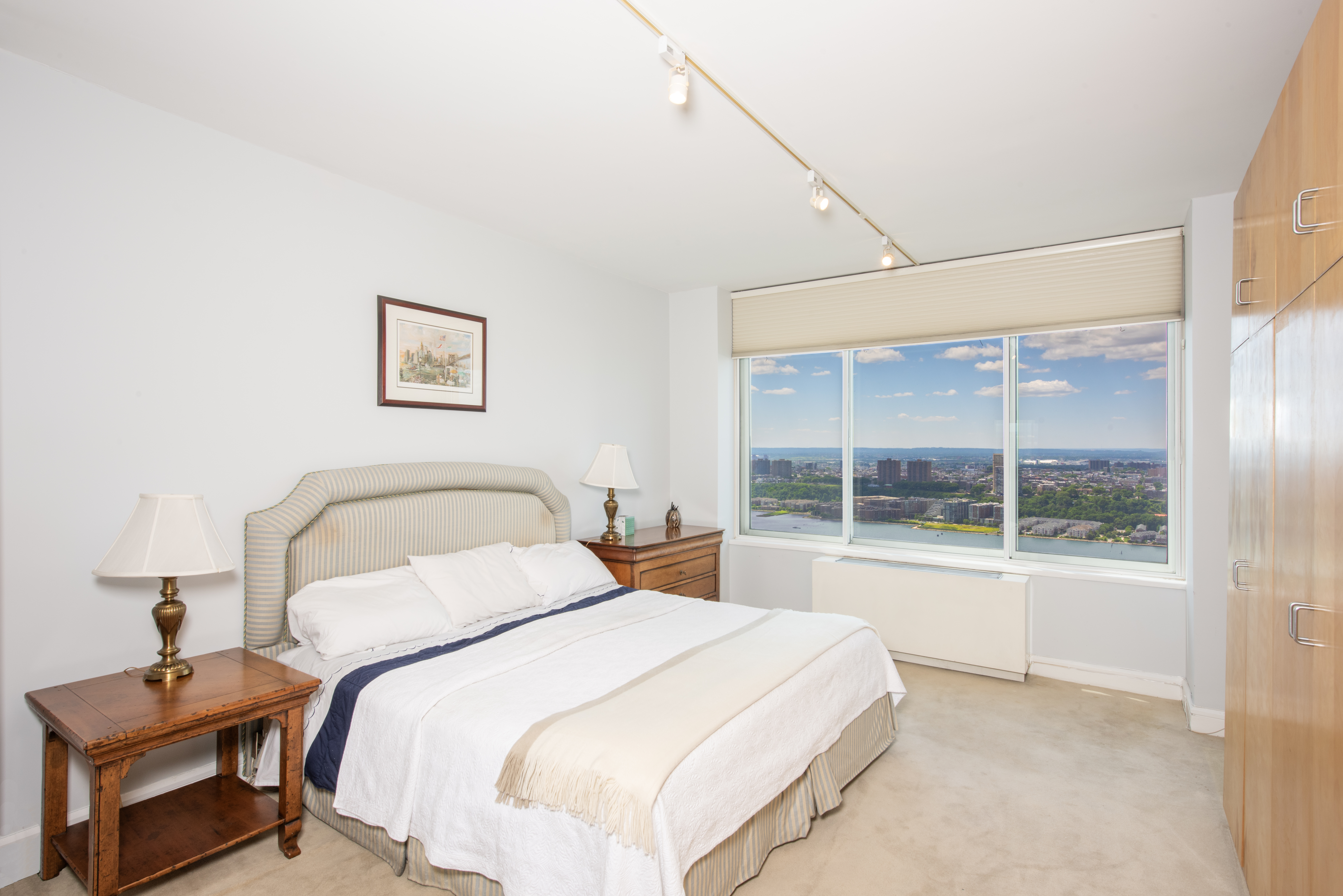 200 Riverside Boulevard, Unit PH1B Manhattan, NY 10069 - Photo 6 of 18 a bedroom with a bed and a window