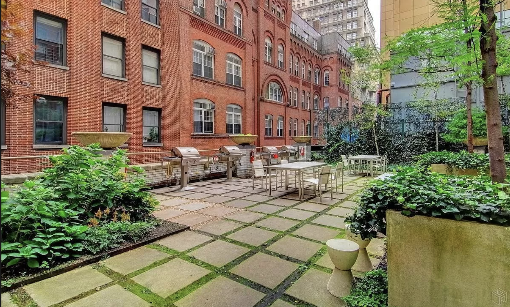 99 John Street, Unit 926 Manhattan, NY 10038 - Photo 9 of 12 a view of a building with garden and sitting area
