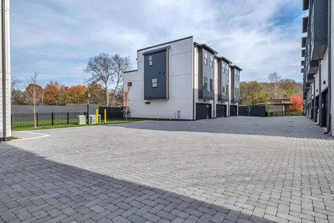 a view of a building with a yard