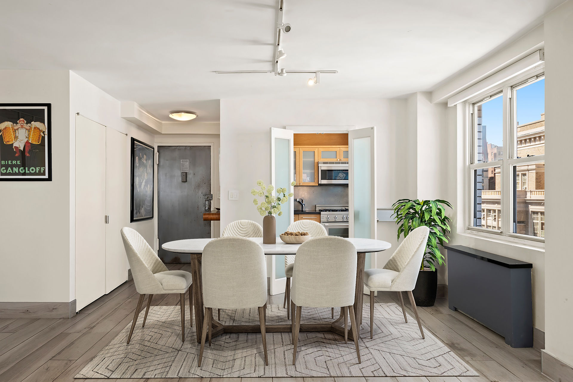 142 East 16th Street, Unit 22B Manhattan, NY 10003 - Photo 6 of 15 a view of a dining room with furniture and a potted plant