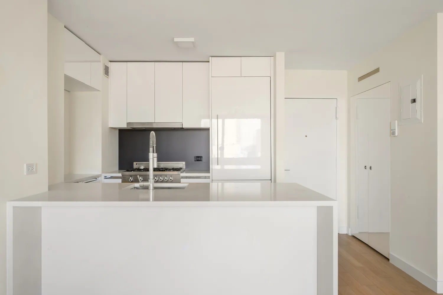 a view of kitchen with sink refrigerator and microwave