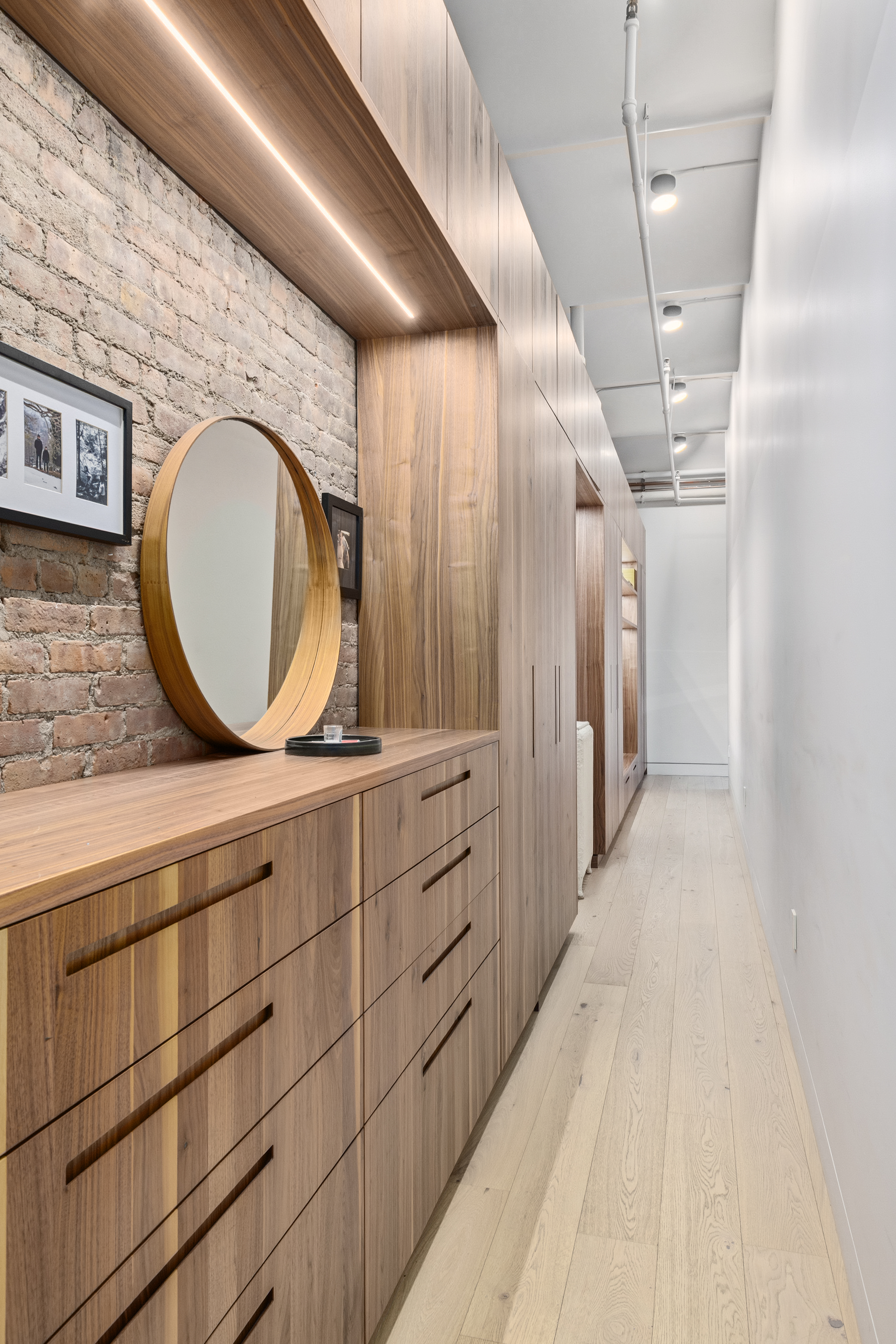1 Great Jones St, Unit 2B Manhattan, NY 10012 - Photo 11 of 12 a bathroom with a double vanity sink and a mirror