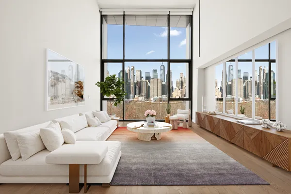 a living room with furniture large window and wooden floor