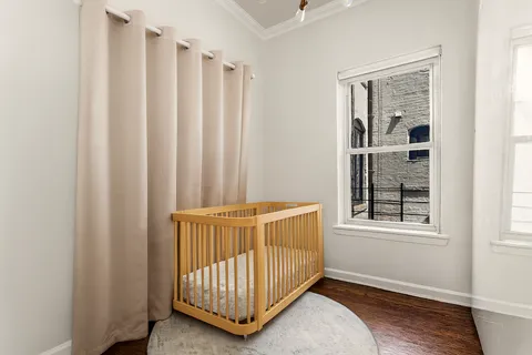 a view of bedroom with furniture and window