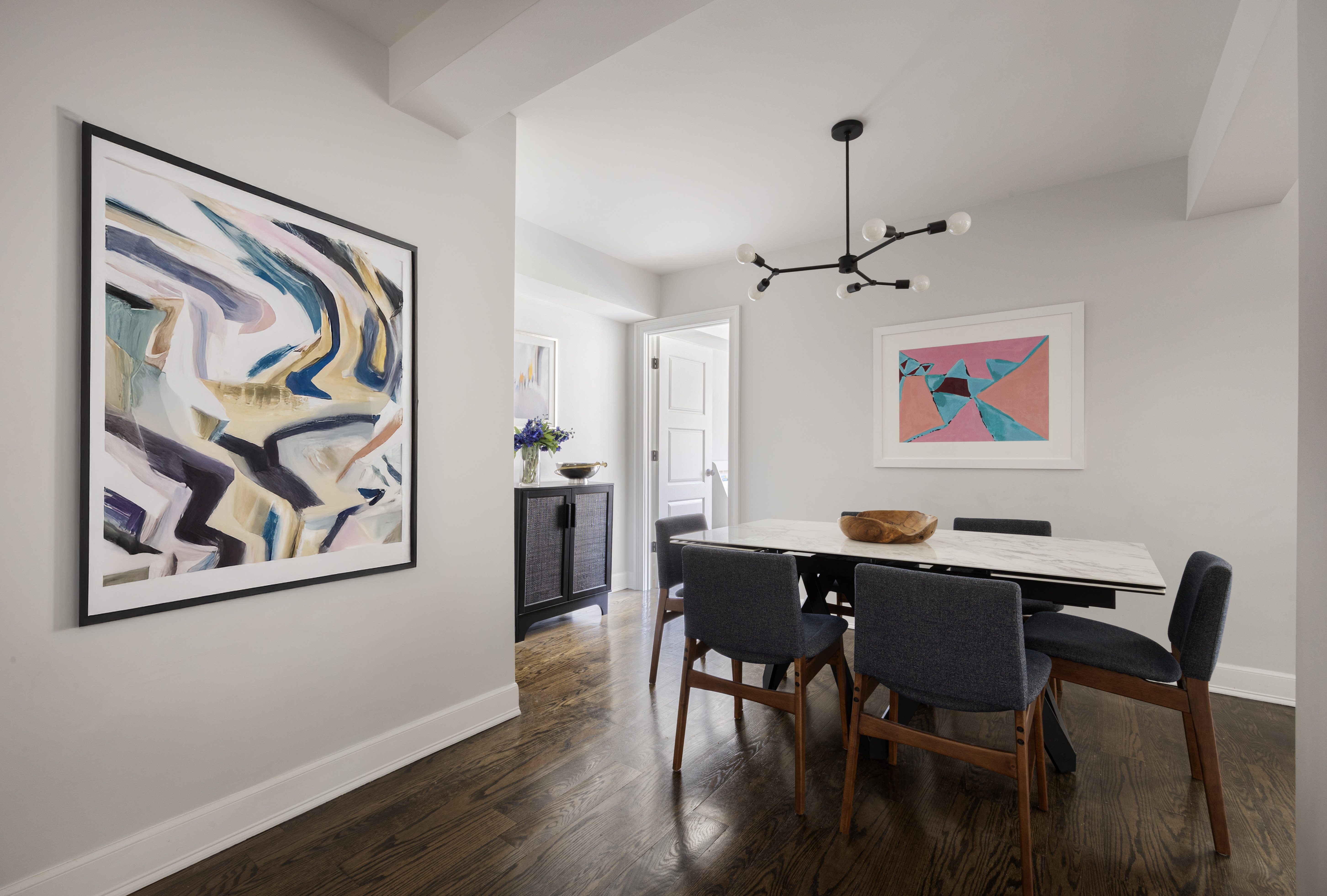 510 East 86th Street, Unit 5C Manhattan, NY 10028 - Photo 4 of 11 a view of a dining room with furniture wooden floor and wall painting