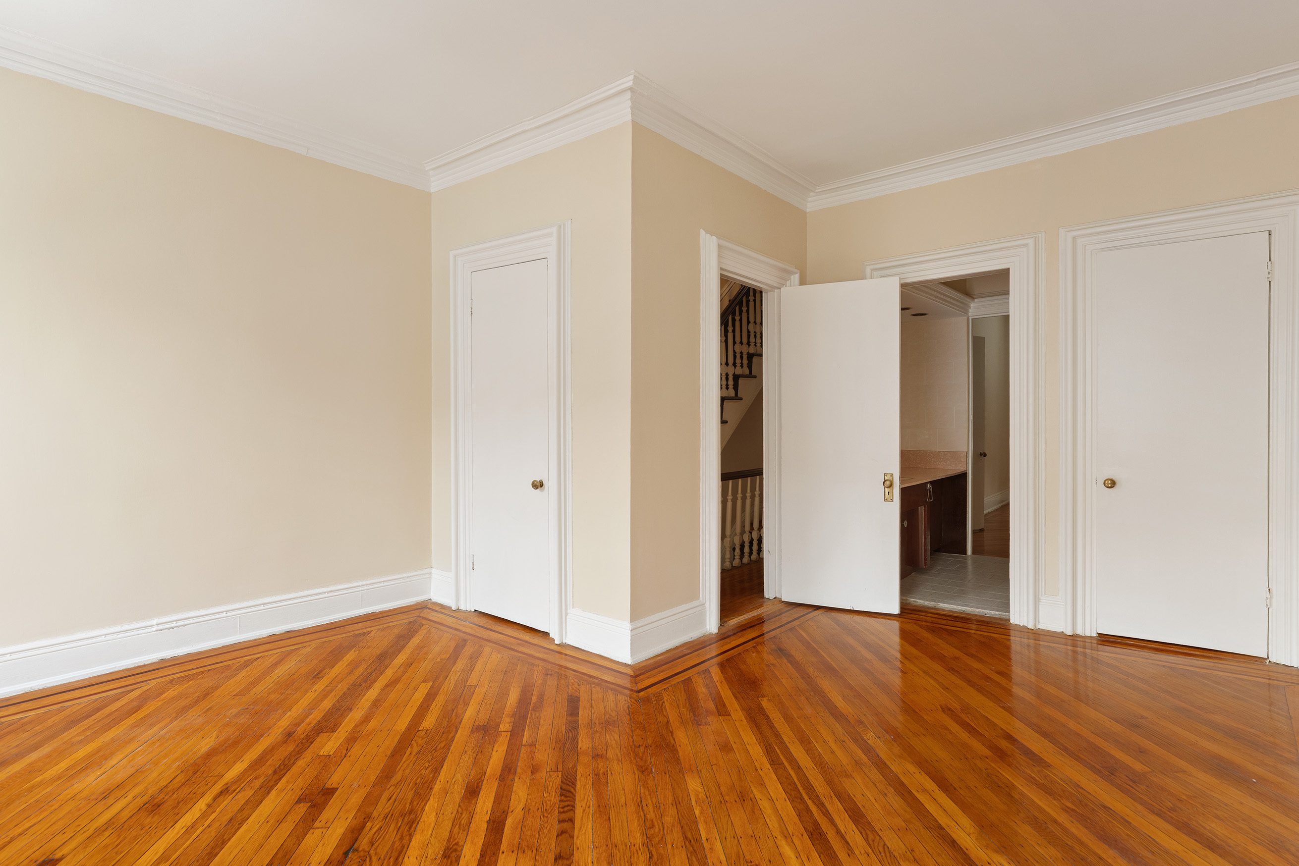 116 Brooklyn Avenue Brooklyn, NY 11216 - Photo 17 of 21 a view of empty room with wooden floor