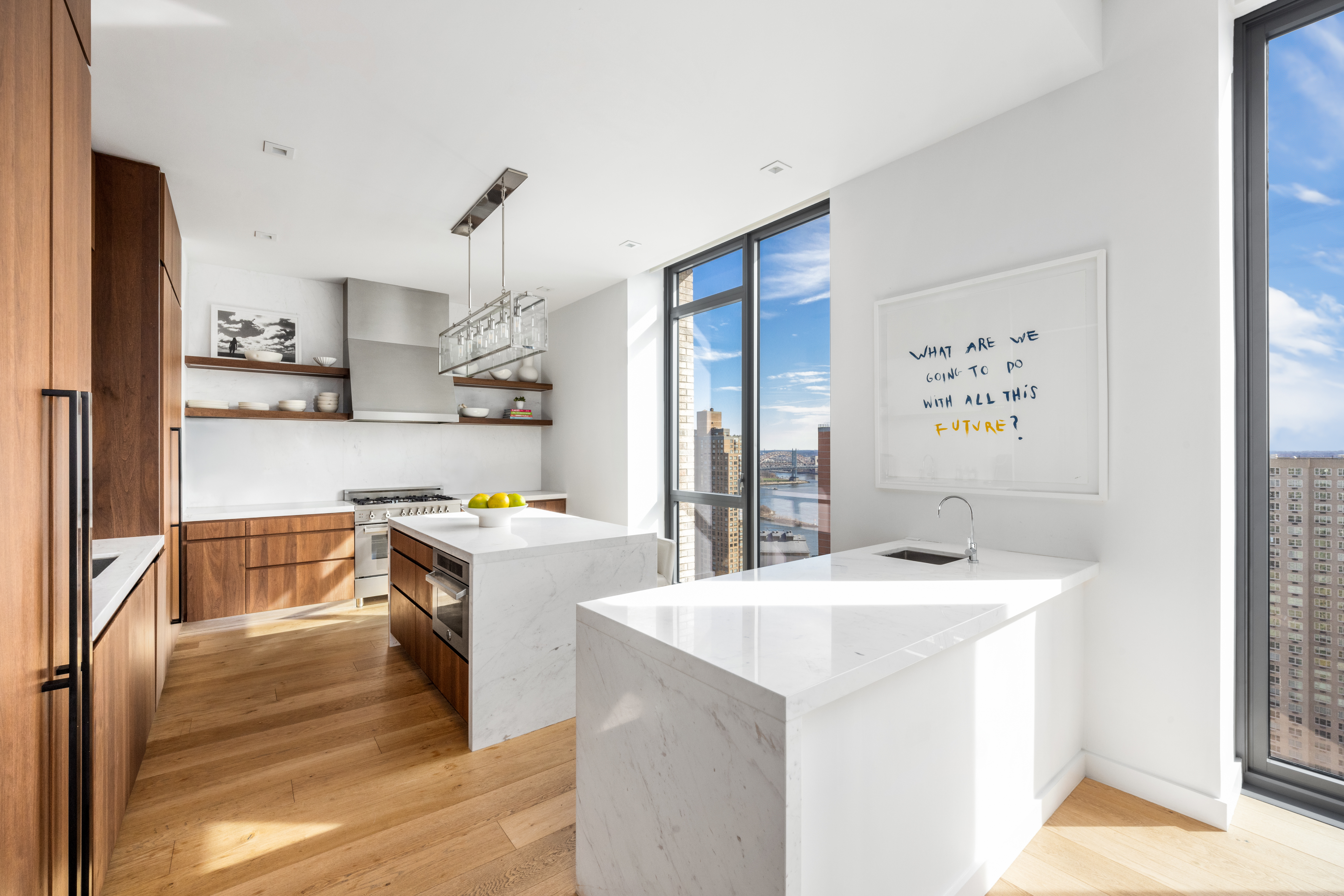 360 East 89th Street, Unit 29B Manhattan, NY 10128 - Photo 5 of 22 a kitchen that has a sink a stove and a refrigerator