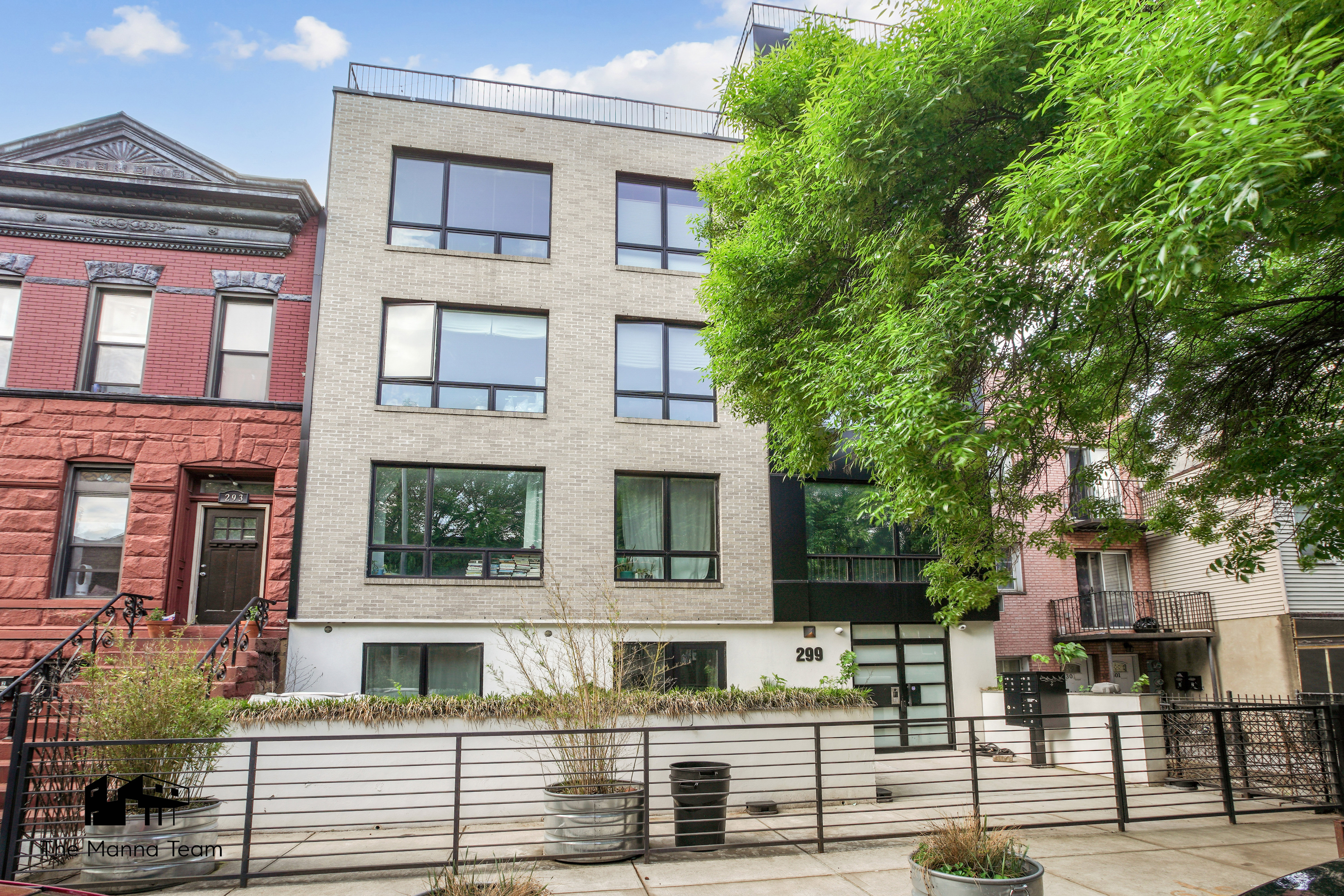 299 Van Buren Street, Unit 4C Brooklyn, NY 11221 - Photo 15 of 16 a front view of a residential apartment building with a yard