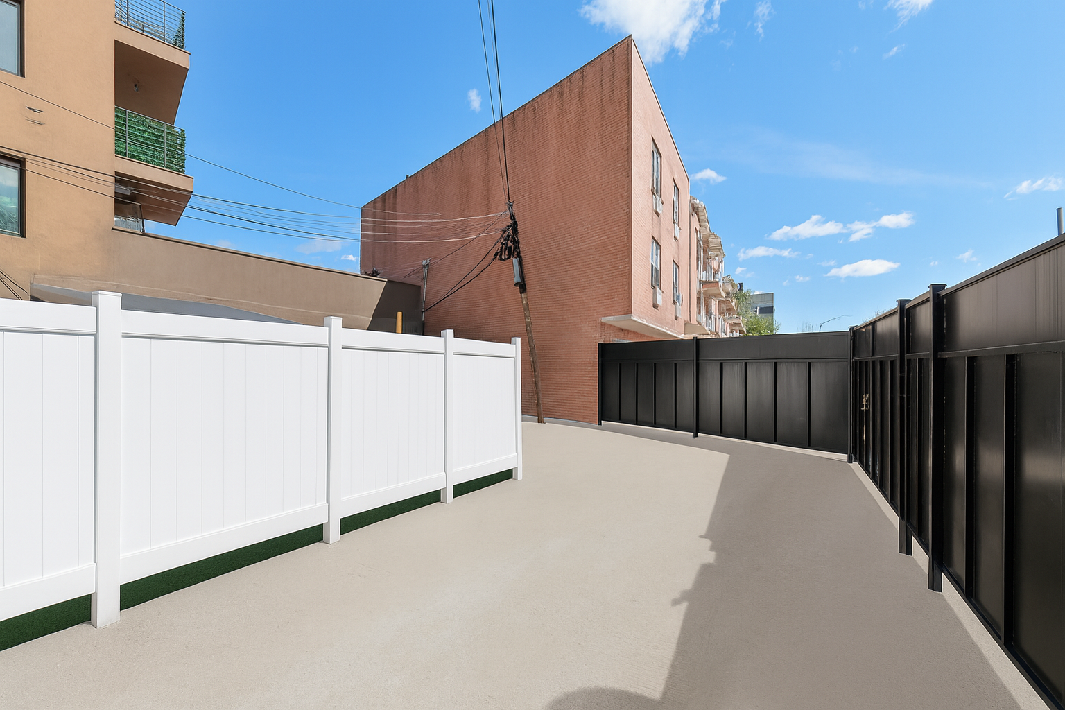 189 Woodpoint Road Brooklyn, NY 11211 - Photo 24 of 26 a view of a backyard with wooden fence