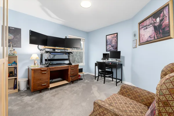 a bathroom with a double vanity sink a mirror and a bathtub