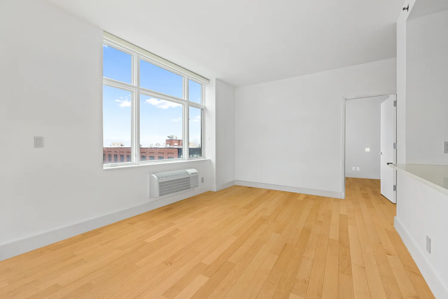 a view of an empty room with a window
