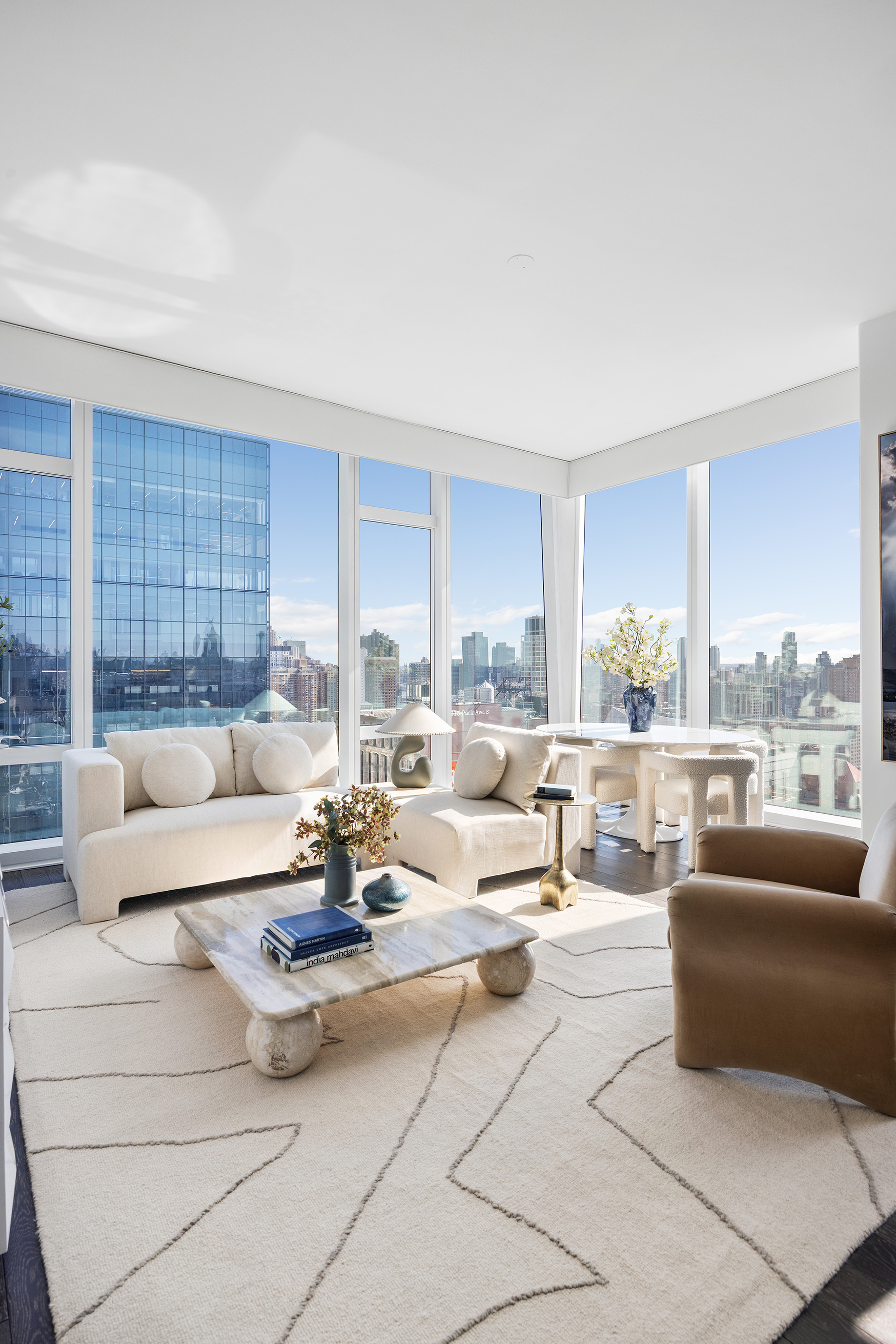 45 East 22nd Street, Unit 32B Manhattan, NY 10010 - Photo 7 of 36 a living room with furniture and a large window