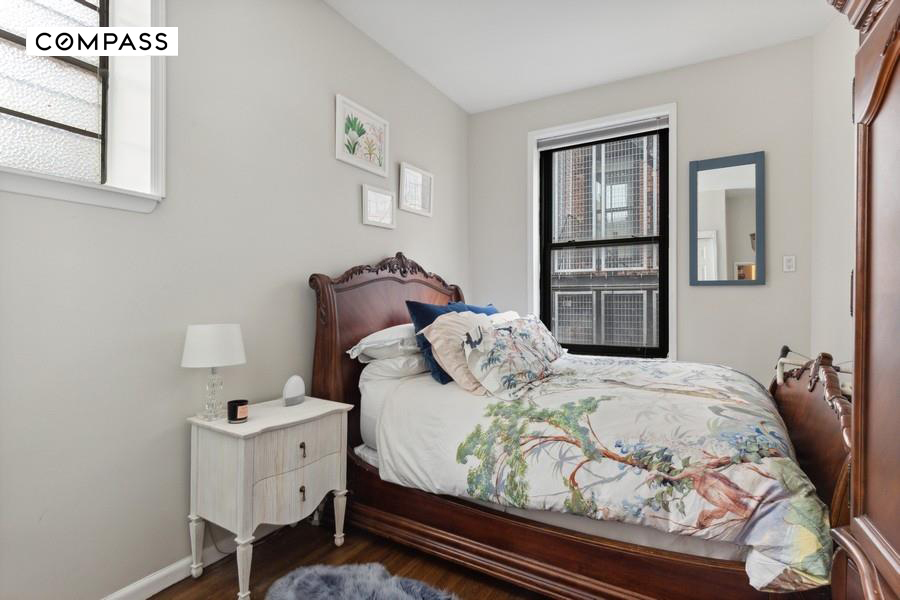 43 East 10th Street, Unit 5J Manhattan, NY 10003 - Photo 3 of 7 a bedroom with a bed and a window