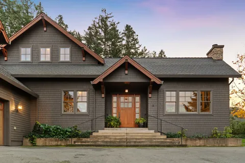 a front view of a house with a yard