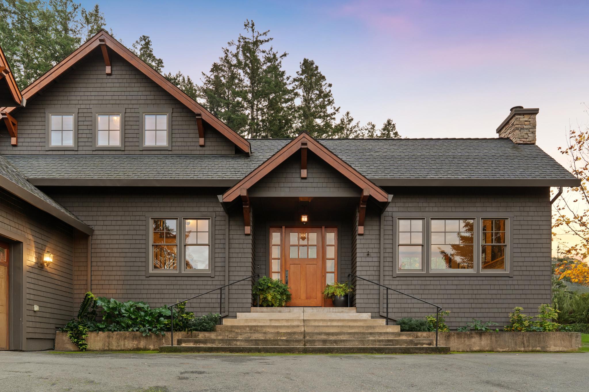 a front view of a house with a yard