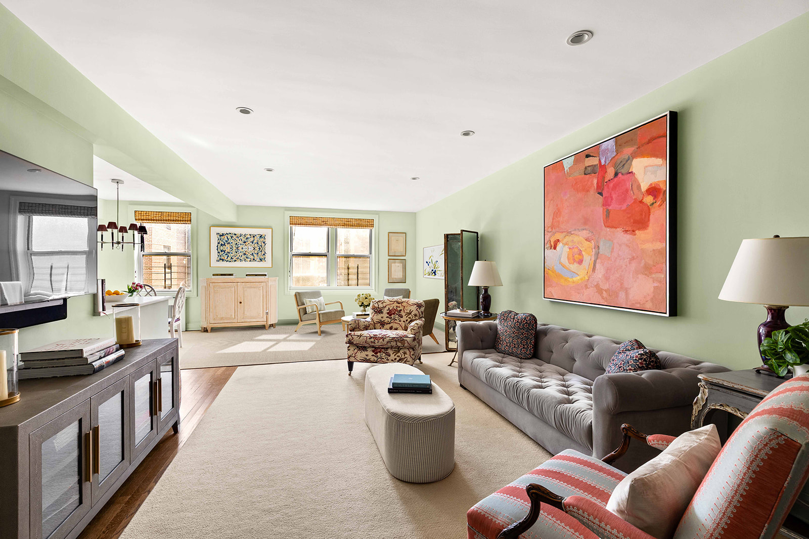 30 East 9th Street, Unit 5LL Manhattan, NY 10003 - Photo 1 of 10 a living room with furniture and a flat screen tv