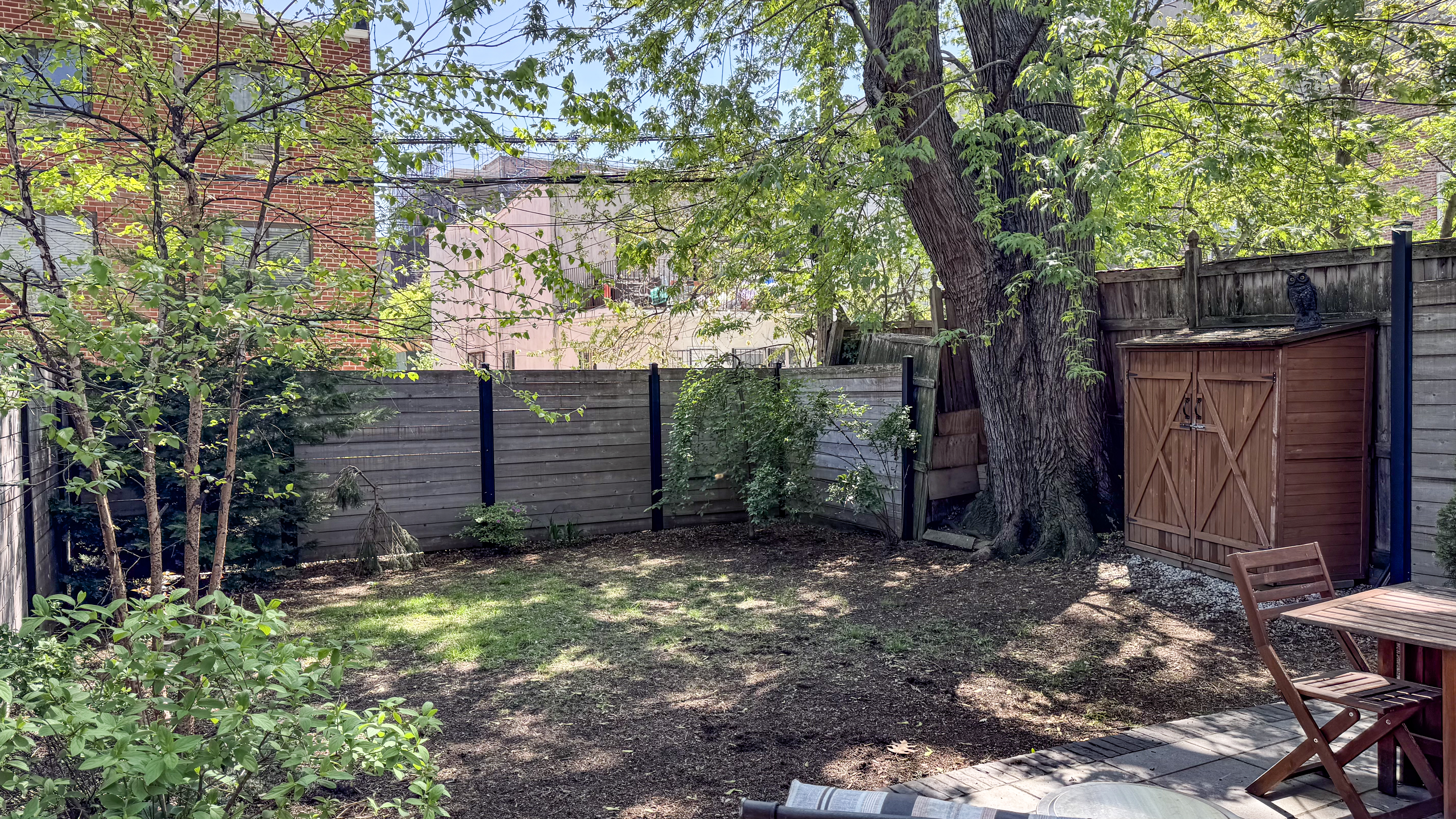 41-27 39th Place Queens, NY 11104 - Photo 10 of 13 a view of a backyard with a tree
