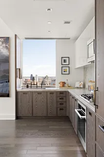 a kitchen with a sink cabinets and stainless steel appliances