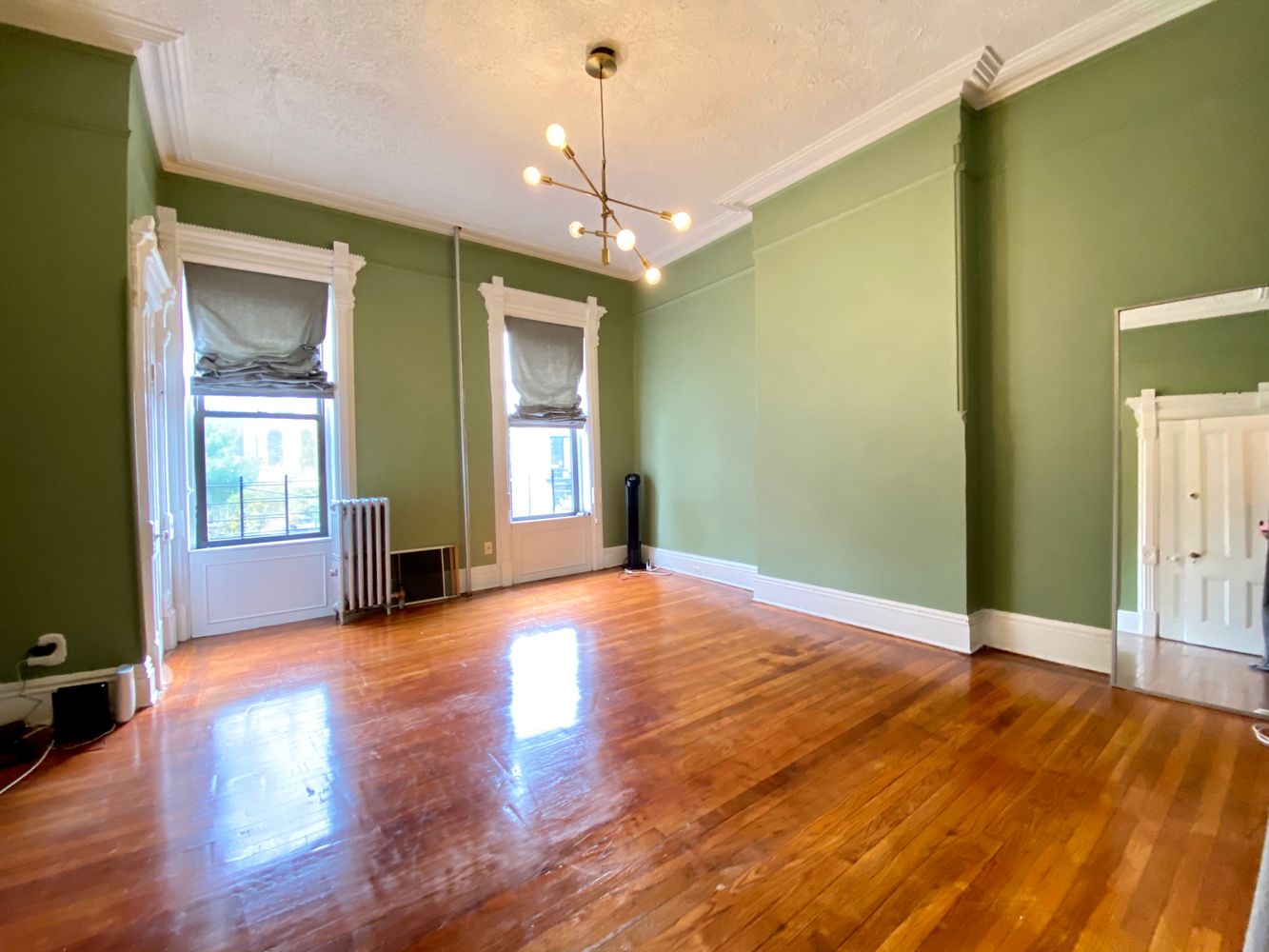 390 5th Street, Unit 1 Brooklyn, NY 11215 - Photo 3 of 15 a view of an empty room with window and wooden floor