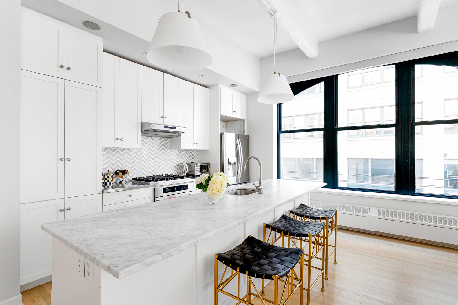 30 Main Street, Unit 3C Brooklyn, NY 11201 - Photo 7 of 18 a kitchen with stainless steel appliances granite countertop a stove a sink and a refrigerator