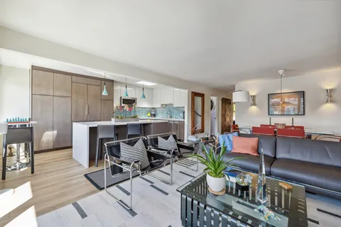 a kitchen with a sink and a stove top oven