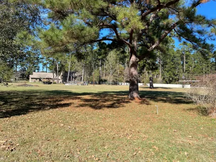 a view of a yard with swimming pool