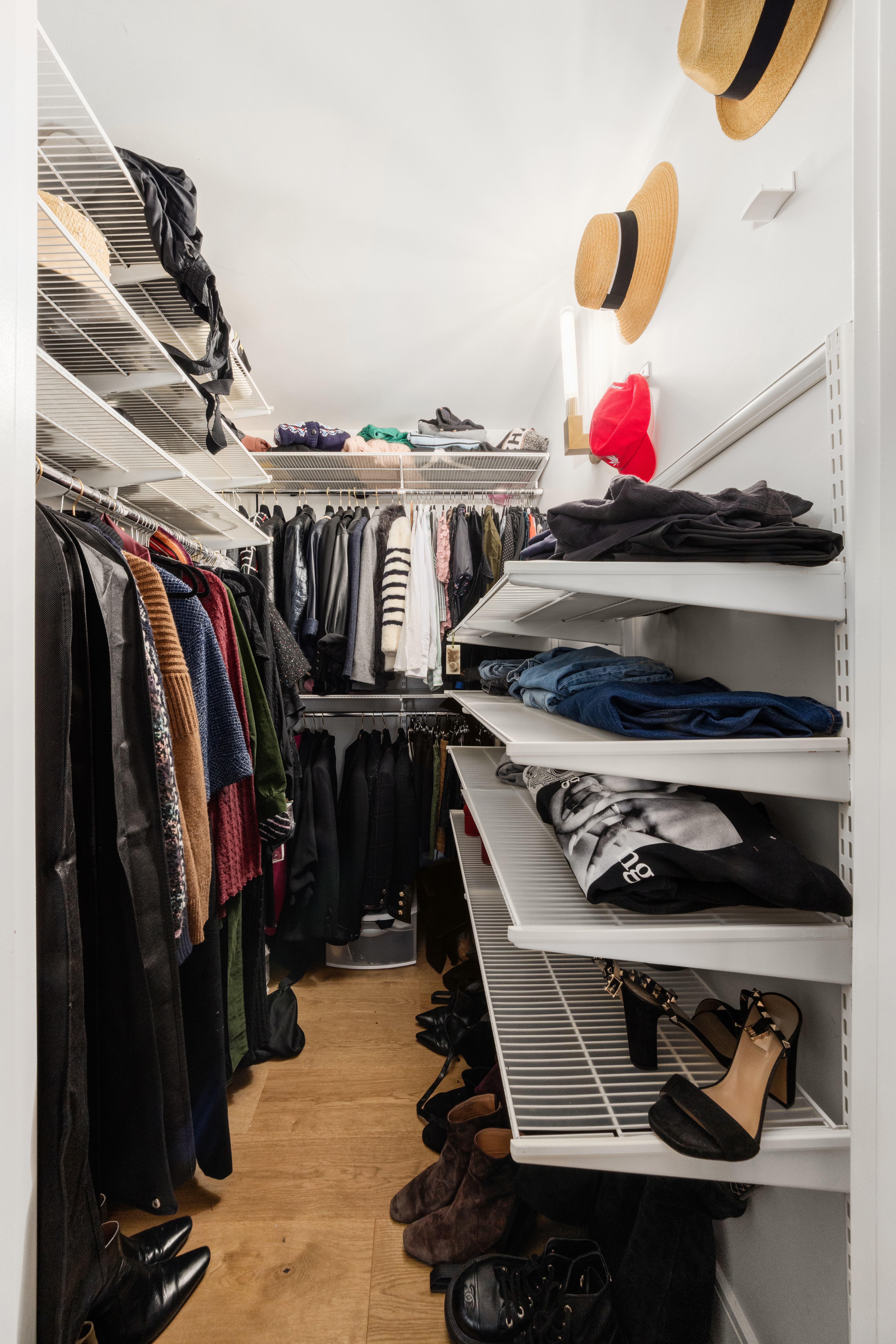 333 East 119th Street, Unit 1H Manhattan, NY 10035 - Photo 13 of 17 a view of walk in closet with clothes and shoes