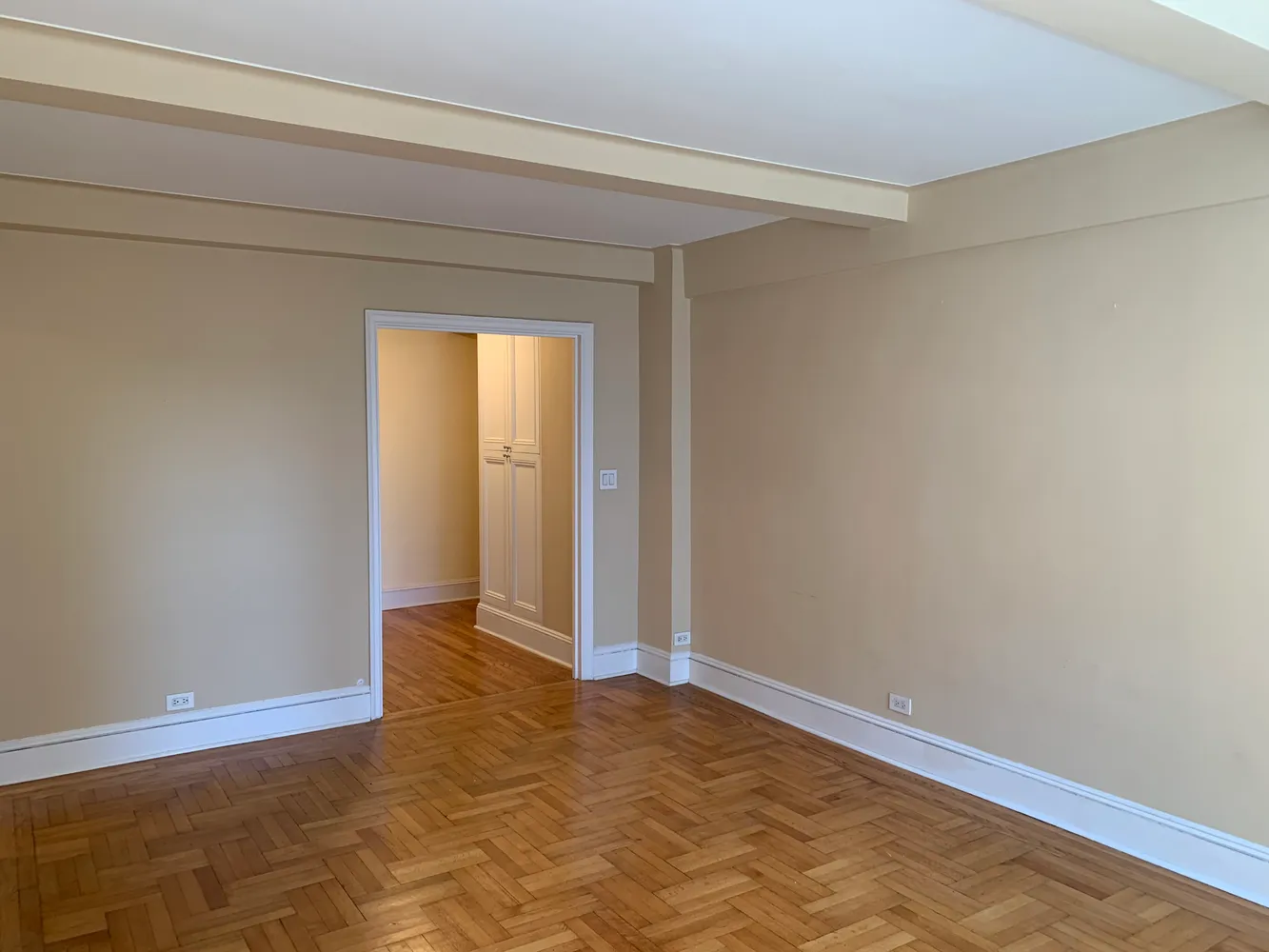 a view of an empty room and window